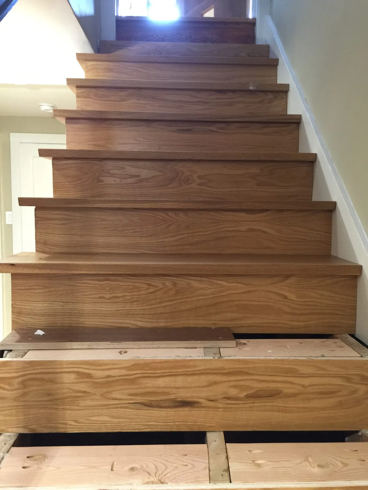 Solid oak basement stair during installation